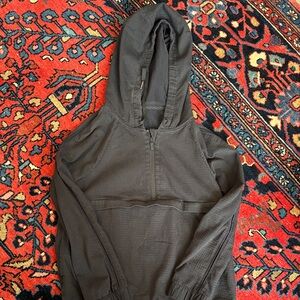 Black Half-Zip Hooded Pullover converts into backpack.
